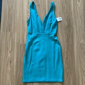 Forever 21 teal deep plunge bodycon dress. Size S.